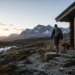 Person leaving a cabin for a rugged mountain path to represent resilience